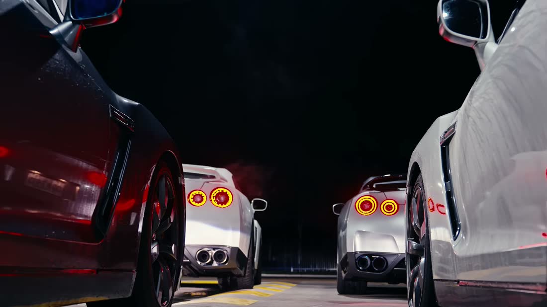 Nissan GT-R lined up at night with tail lights glowing