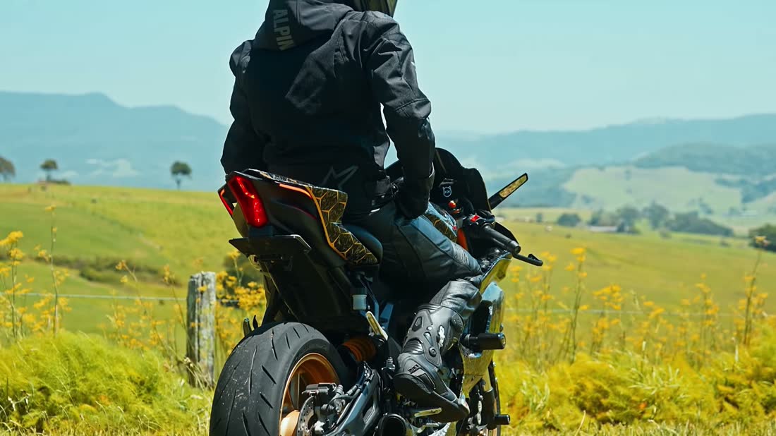 Rider on a sportbike in open countryside