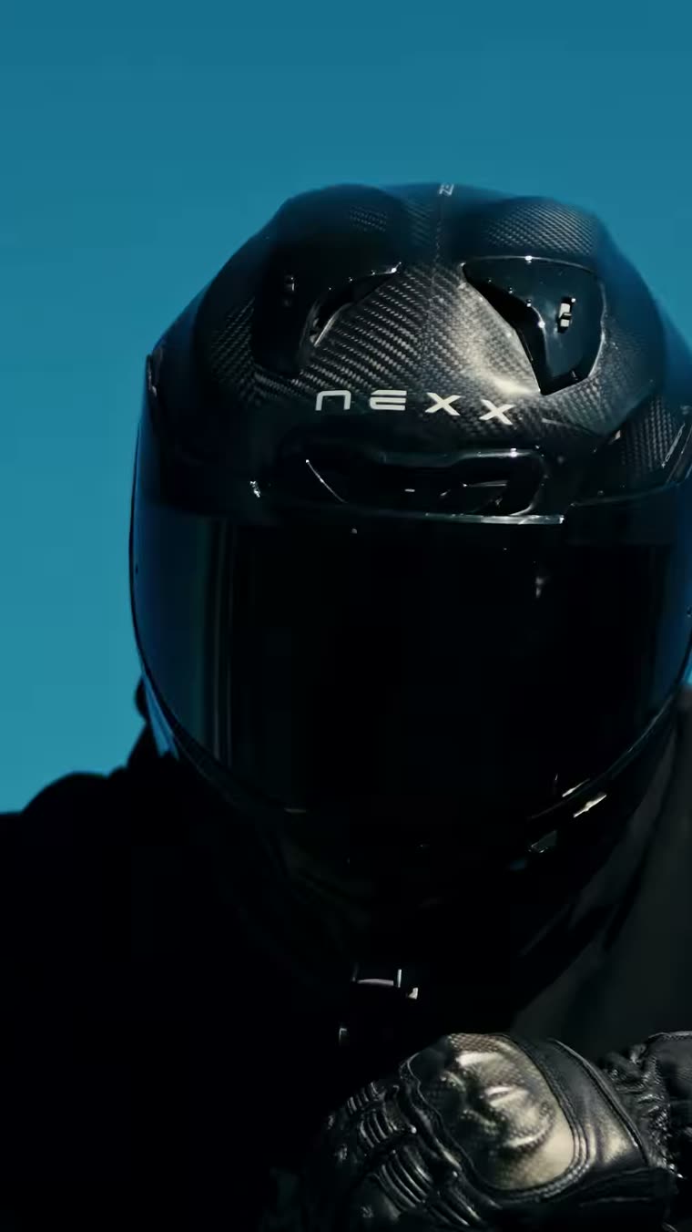 Rider in Fallen branded apparel on a motorcycle by the coast